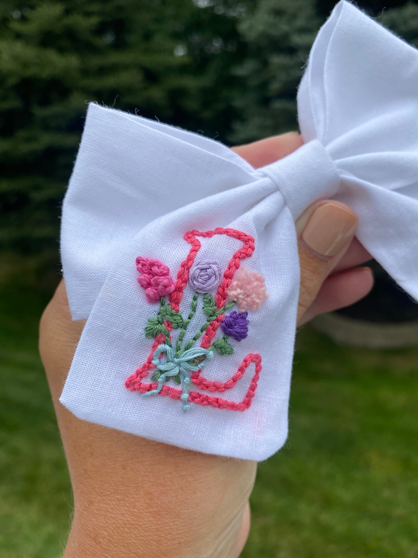 Hand embroidered initial bow with flowers