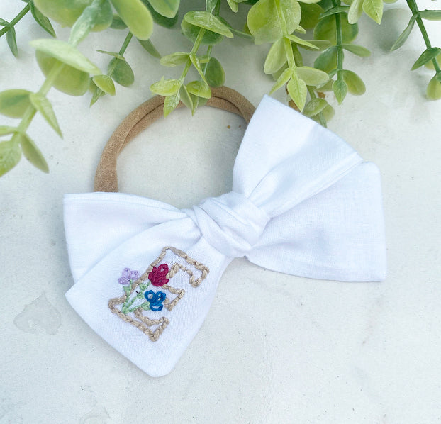 Hand embroidered initial bow with flowers