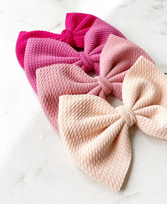 Pink shades of oversized bows