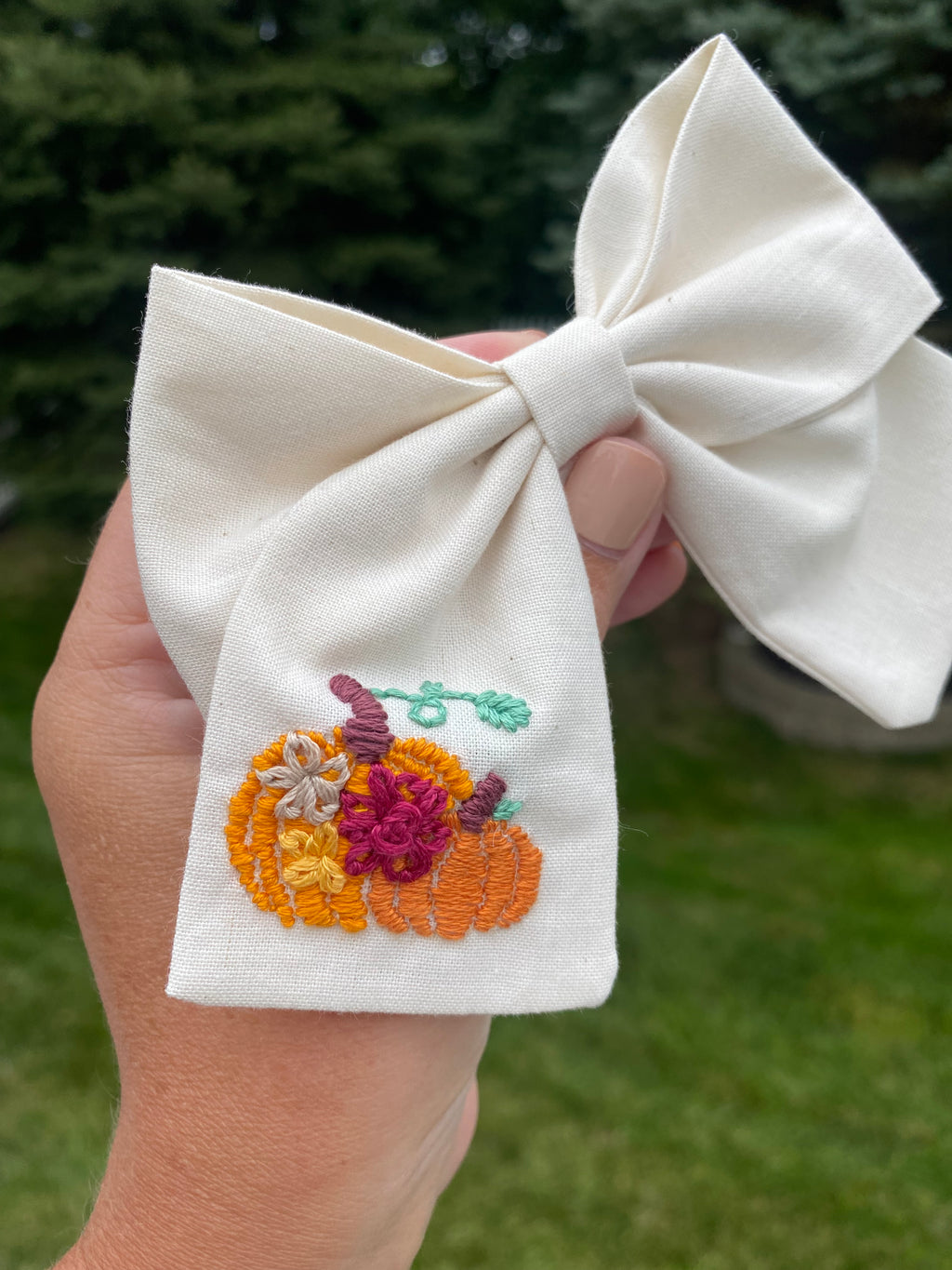 Hand embroidered pumpkin bow with flowers