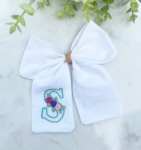 Hand embroidered initial bow with flowers