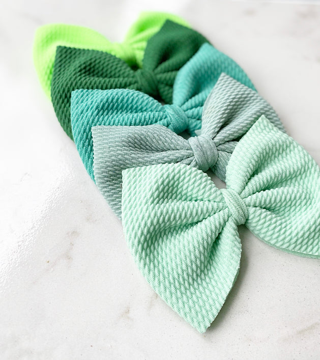 Shades of green oversized bows