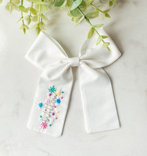 Embroidered name bow