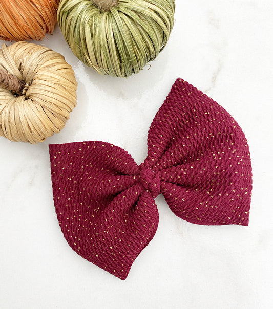 Maroon glitter specks, oversized bow